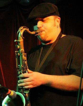 John Aruda DJing with Brass